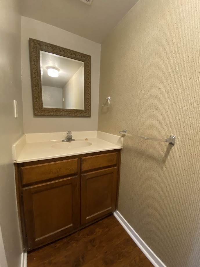 1305 West Villa Maria Road, Unit B104 Bryan, TX 77801 - Photo 4 of 14 a bathroom with a sink vanity and mirror