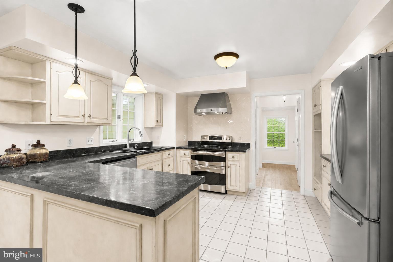 5602 Patterson Road Baldwin, MD 21013 - Photo 51 of 87 Kitchen with cream cabinets & composite counters
