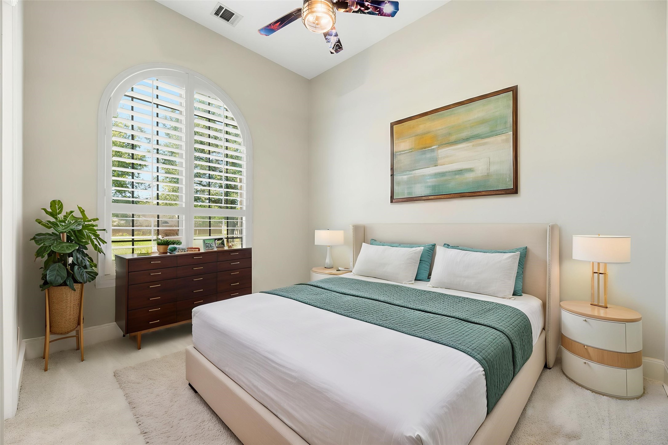 28226 South Firethorne Road Katy, TX 77494 - Photo 23 of 39 Conveniently located on the main level, this spacious secondary bedroom features a private bathroom, arched window with custom shutters and high ceilings, making it an ideal space for a guest retreat or in-law quarters. Virtually staged.