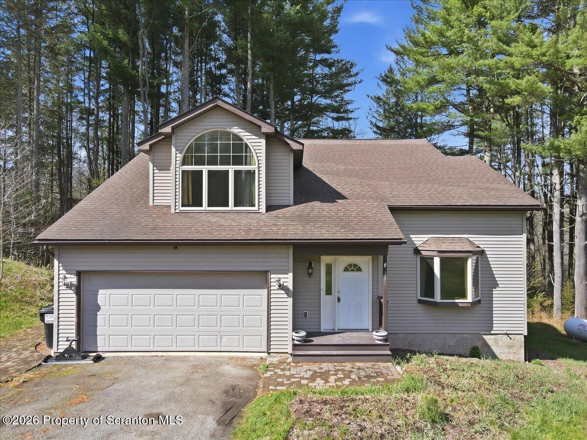 381 Goose Pond Road Lake Ariel, PA 18436 - Photo 1 of 81 a front view of a house with garden