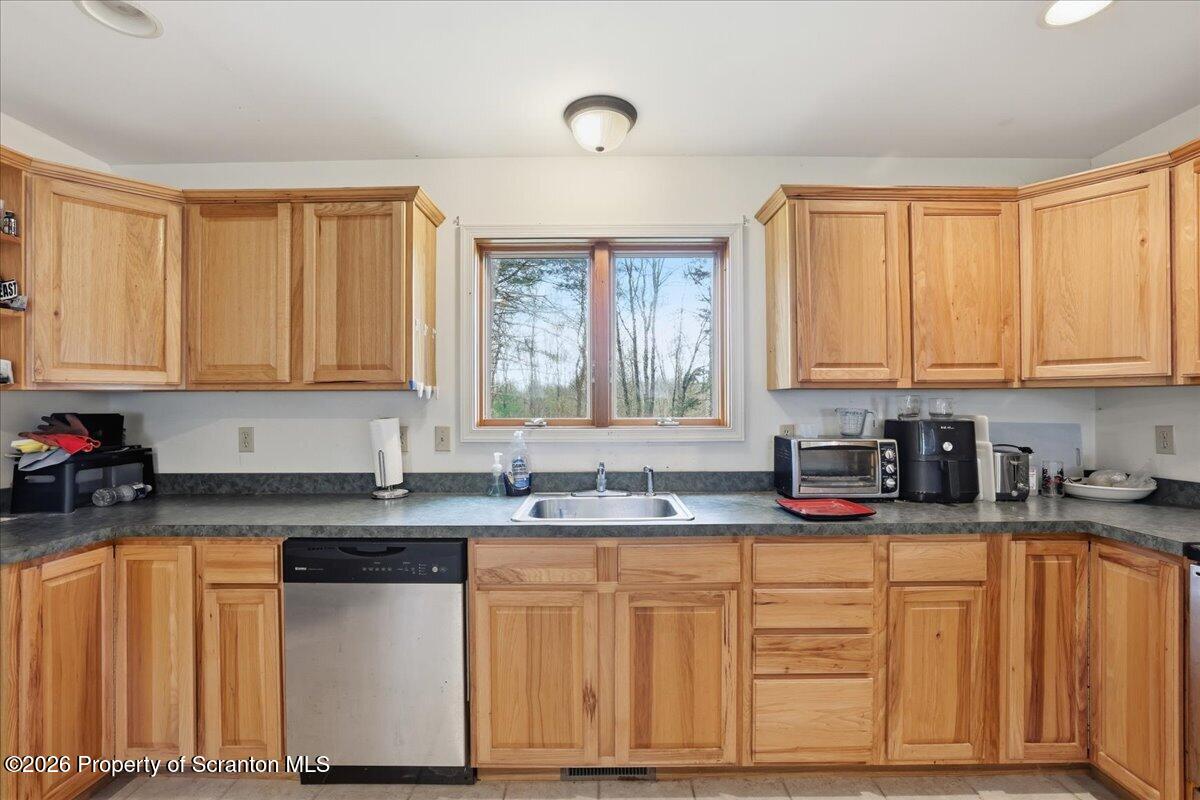 381 Goose Pond Road Lake Ariel, PA 18436 - Photo 22 of 81 a kitchen with stainless steel appliances granite countertop a sink stove and cabinets