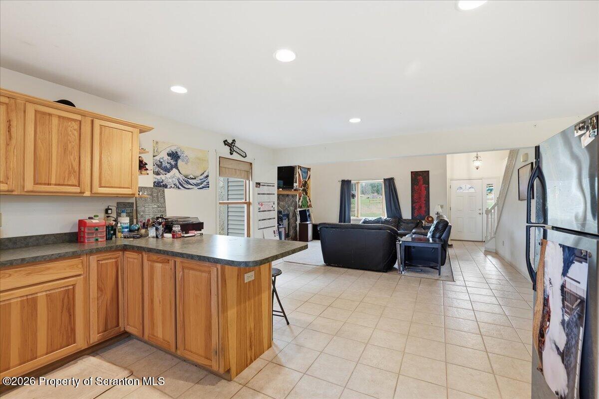 381 Goose Pond Road Lake Ariel, PA 18436 - Photo 23 of 81 a kitchen with refrigerator and cabinets