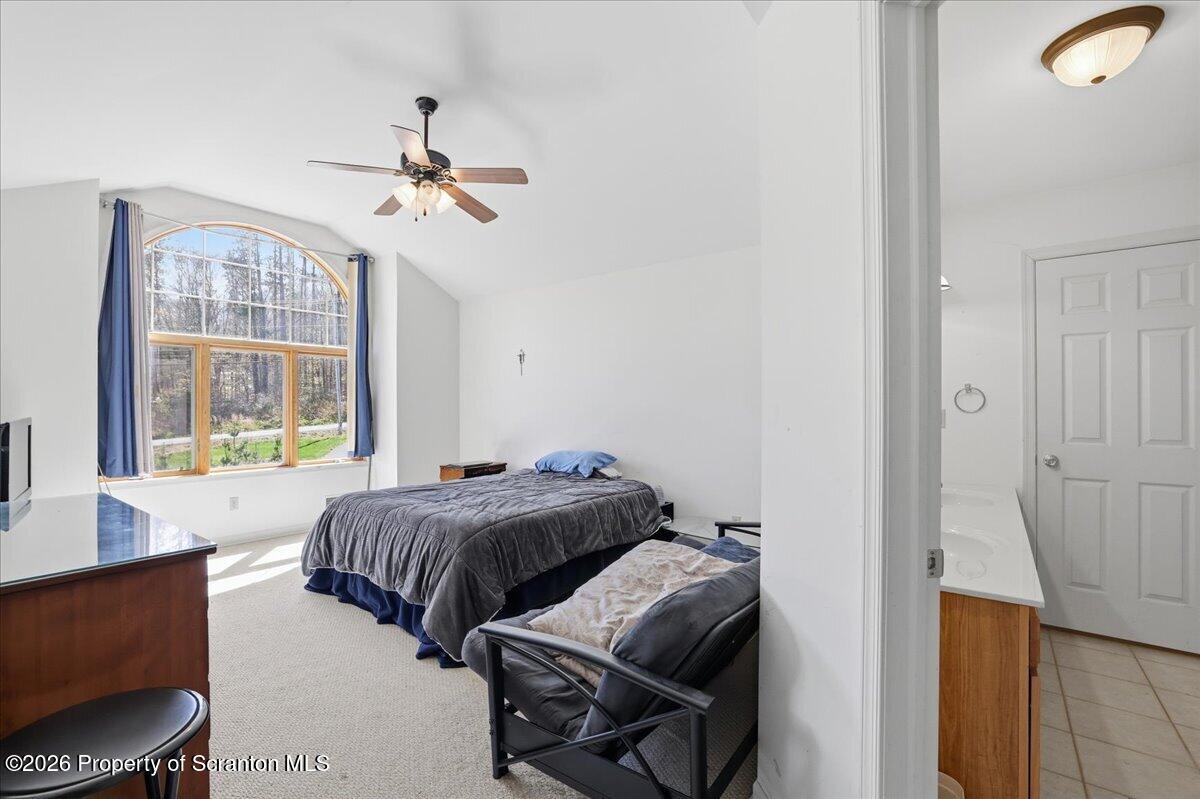 381 Goose Pond Road Lake Ariel, PA 18436 - Photo 37 of 81 a bedroom with a bed and a window