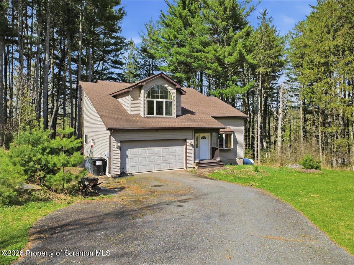 381 Goose Pond Road Lake Ariel, PA 18436 - Photo 4 of 81 a front view of a house with a yard