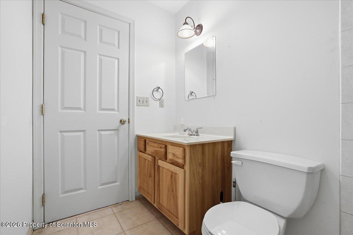 381 Goose Pond Road Lake Ariel, PA 18436 - Photo 41 of 81 a bathroom with a sink a toilet and mirror