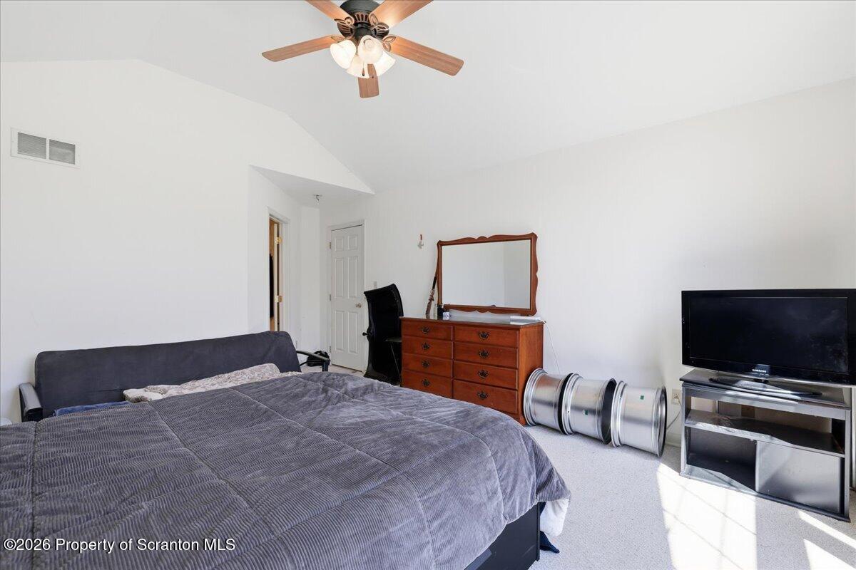 381 Goose Pond Road Lake Ariel, PA 18436 - Photo 44 of 81 a bedroom with a bed and a flat screen tv