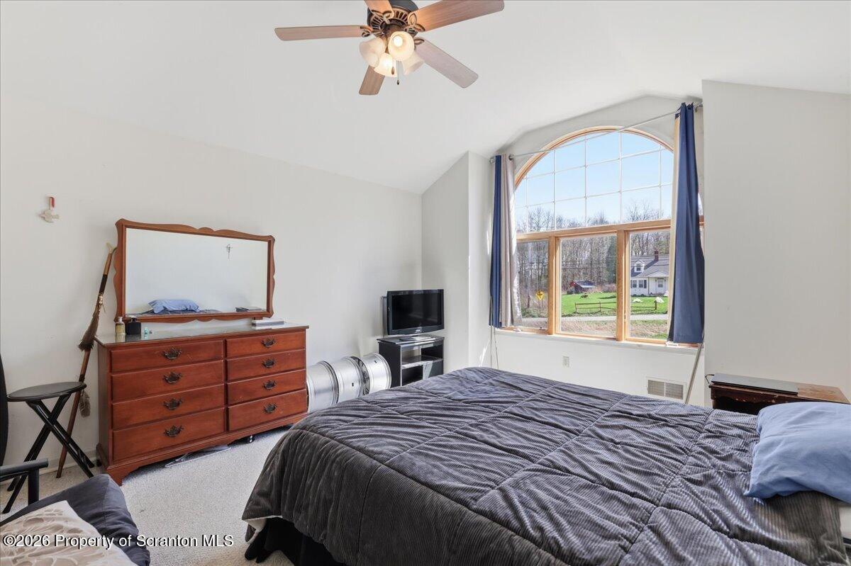 381 Goose Pond Road Lake Ariel, PA 18436 - Photo 46 of 81 a bedroom with a bed and a window