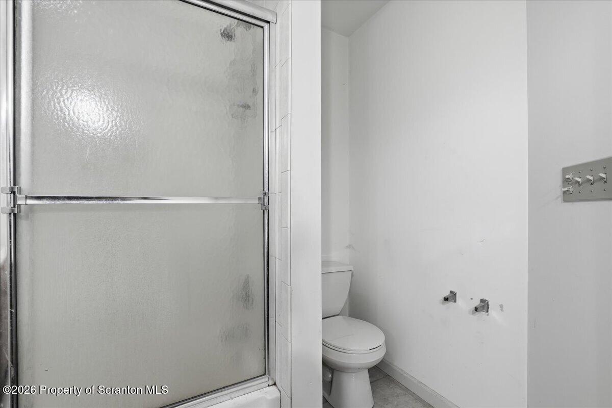 381 Goose Pond Road Lake Ariel, PA 18436 - Photo 51 of 81 a bathroom with a granite countertop toilet and a shower