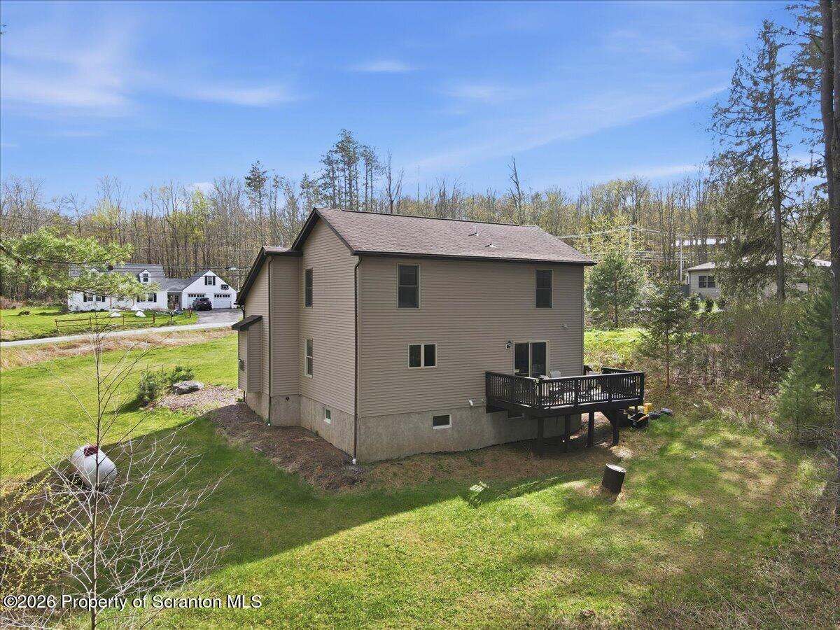 381 Goose Pond Road Lake Ariel, PA 18436 - Photo 69 of 81 a view of a house with backyard and sitting area