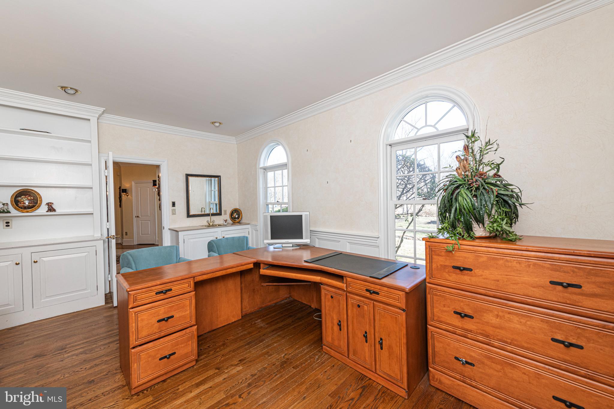 516 Sugartown Road Devon, PA 19333 - Photo 17 of 77 a kitchen with granite countertop wooden cabinets and white appliances