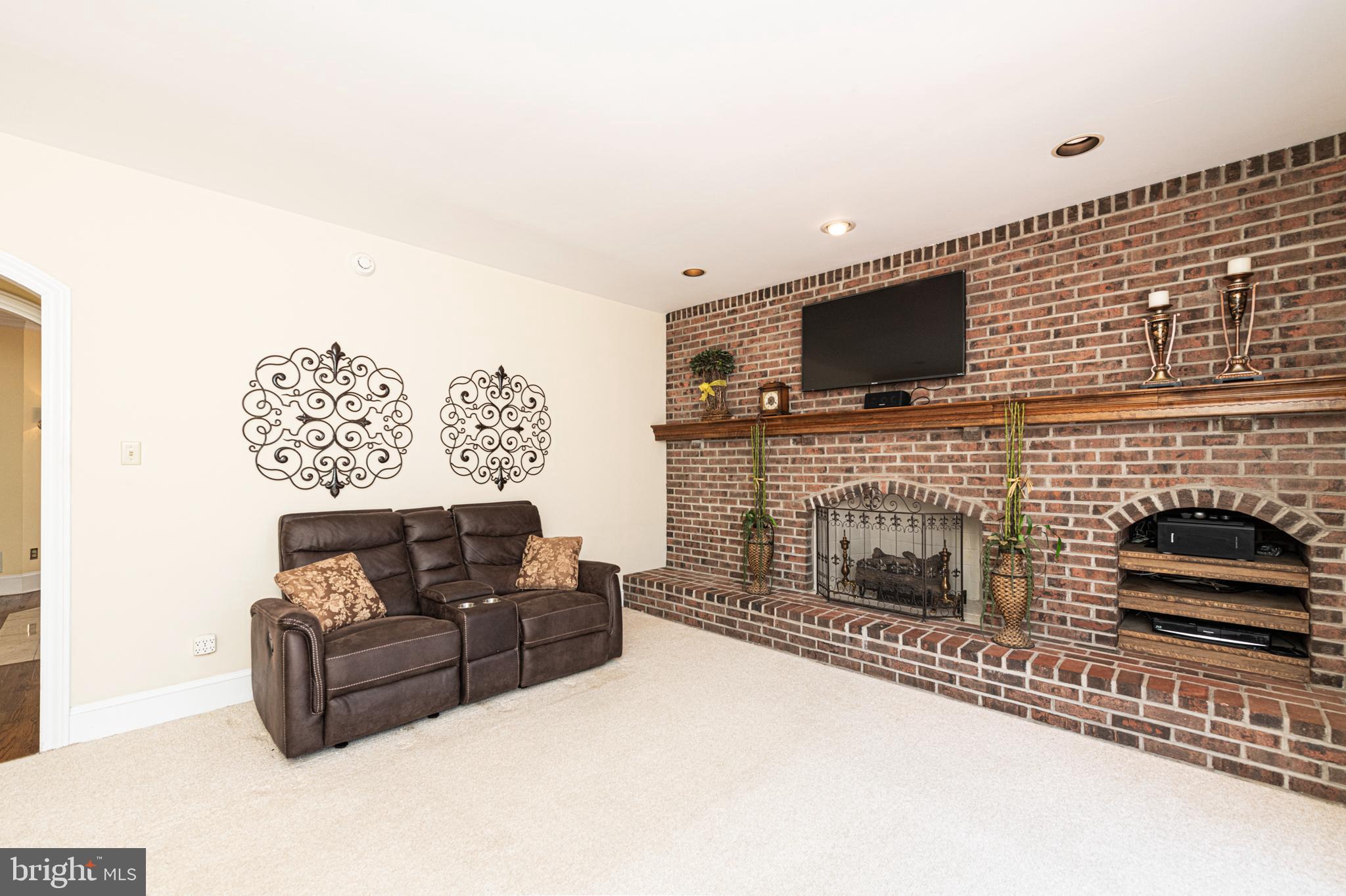 516 Sugartown Road Devon, PA 19333 - Photo 26 of 77 a living room with furniture and a flat screen tv
