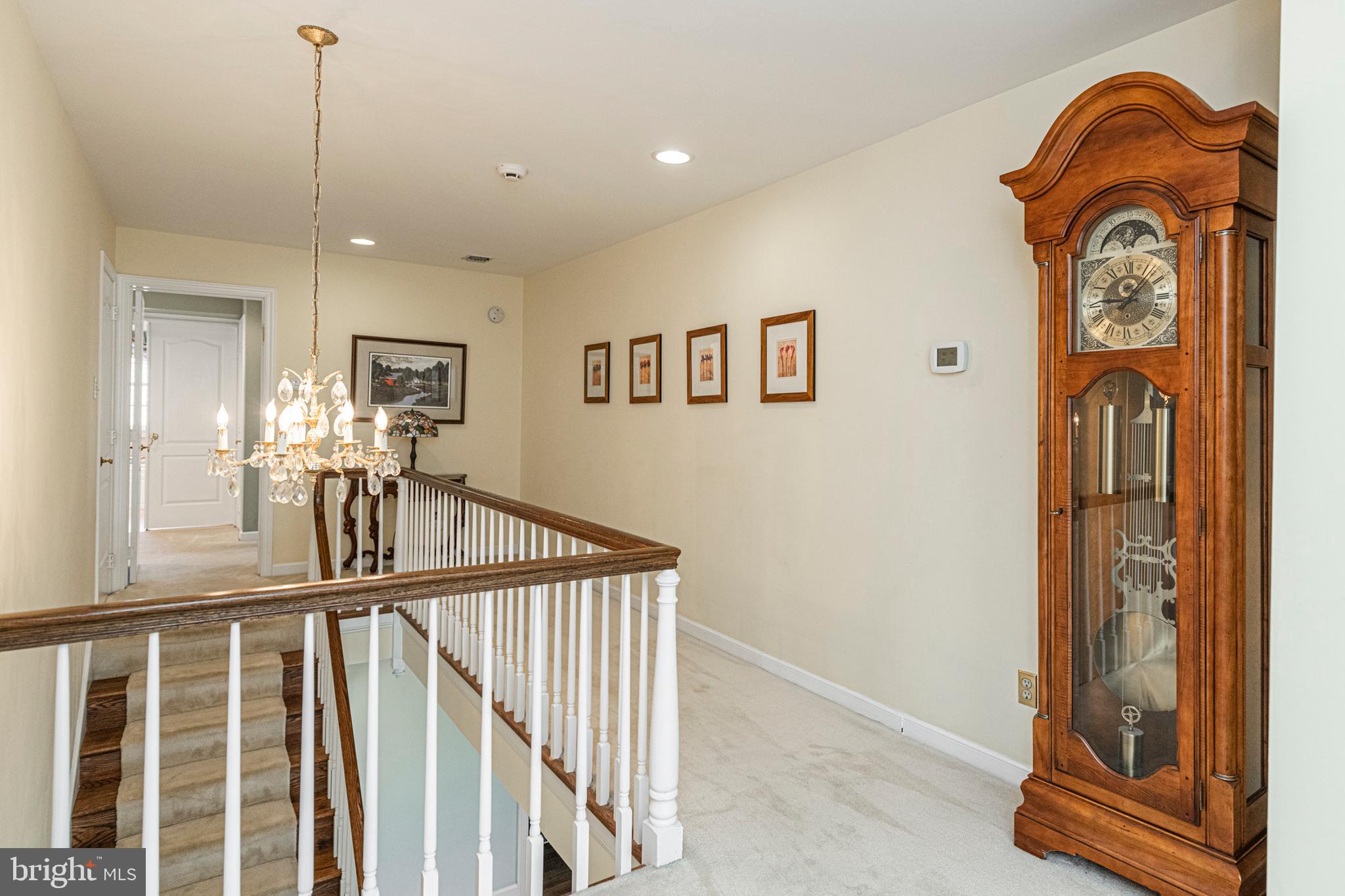 516 Sugartown Road Devon, PA 19333 - Photo 34 of 77 a view of a hallway with entryway wooden floor and dining room view