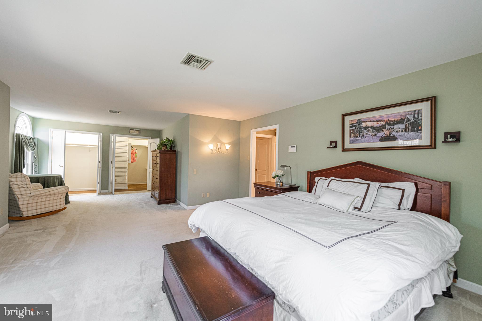 516 Sugartown Road Devon, PA 19333 - Photo 36 of 77 a spacious bedroom with a bed a couch and dresser