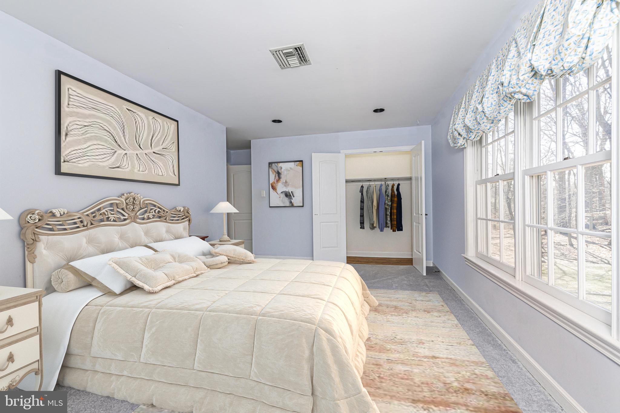 516 Sugartown Road Devon, PA 19333 - Photo 49 of 77 a spacious bedroom with a large bed and a large window