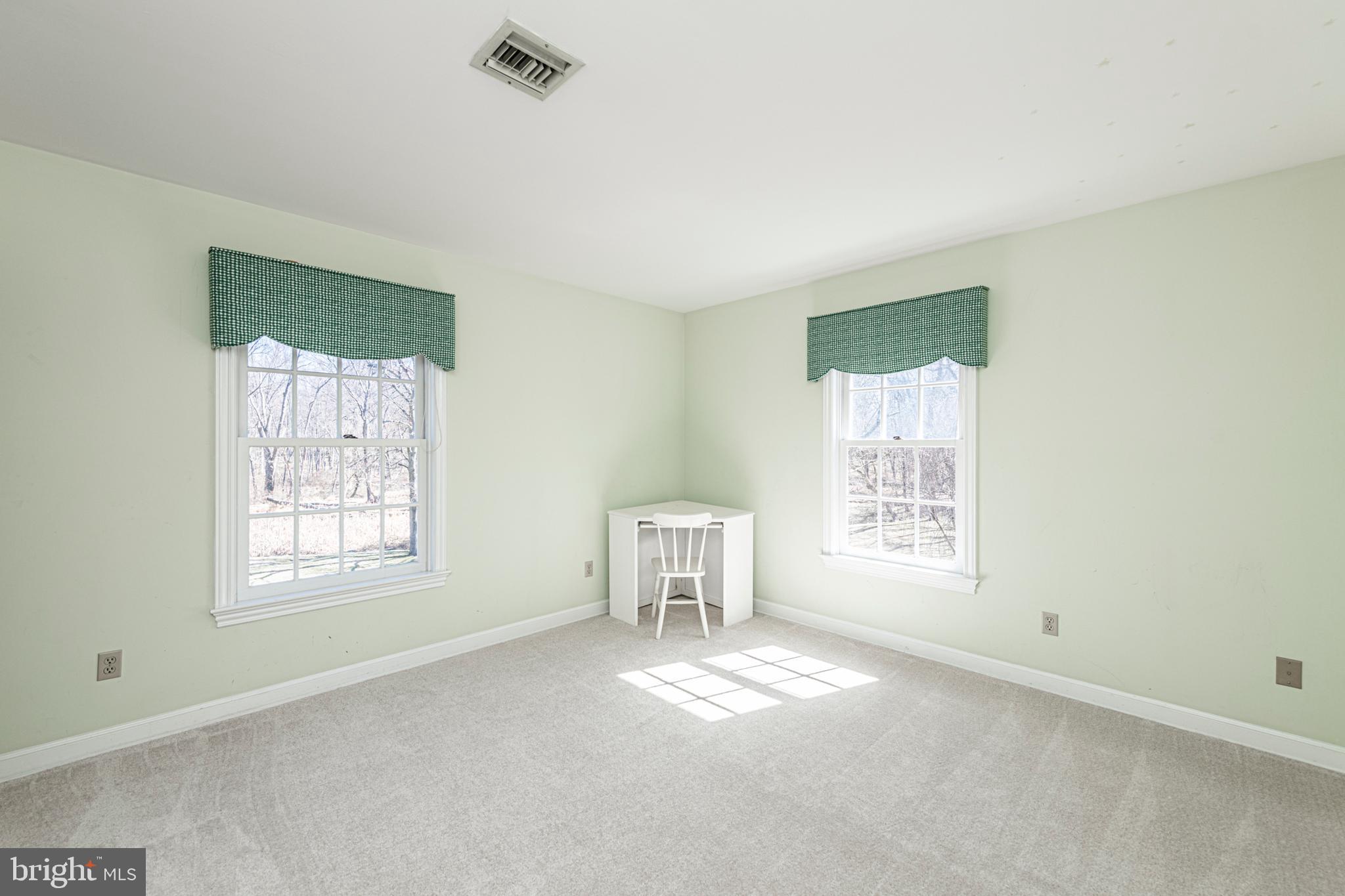 516 Sugartown Road Devon, PA 19333 - Photo 57 of 77 a view of an empty room with a window