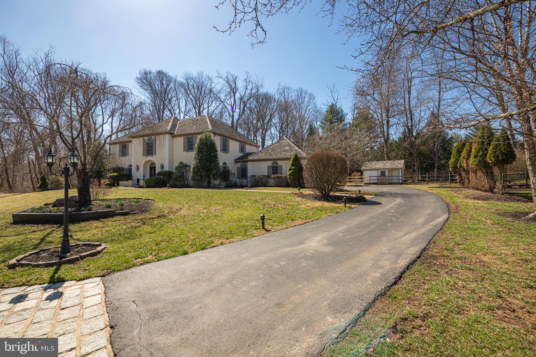 516 Sugartown Road Devon, PA 19333 - Photo 6 of 77 a view of a house with yard and trees in the background