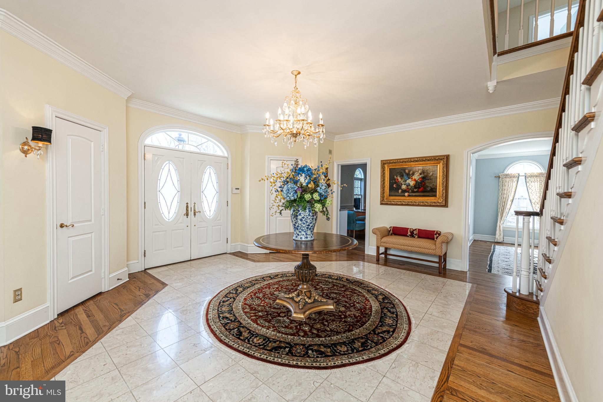 516 Sugartown Road Devon, PA 19333 - Photo 9 of 77 a living room with furniture and a chandelier