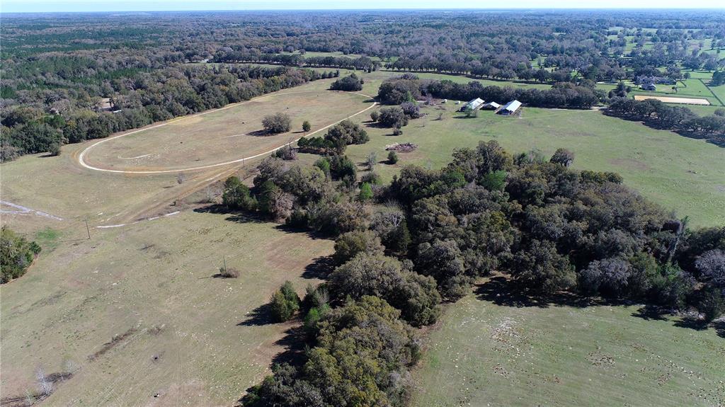 823 Southeast 116th Pl Road Ocala, FL 34480 - Photo 11 of 15 an aerial view of a house with a yard