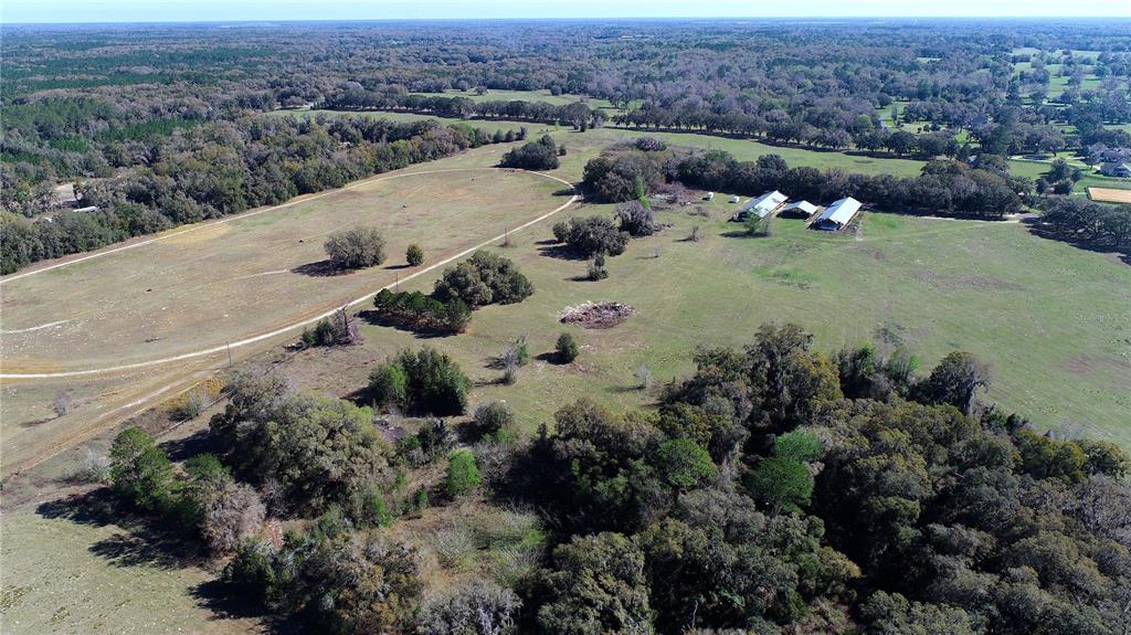 823 Southeast 116th Pl Road Ocala, FL 34480 - Photo 13 of 15 an aerial view of a house with a yard
