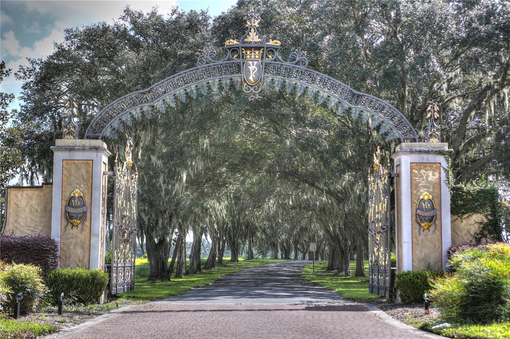 823 Southeast 116th Pl Road Ocala, FL 34480 - Photo 2 of 15 a front view of a house with a yard and large trees