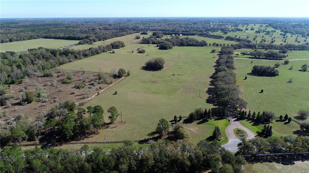 823 Southeast 116th Pl Road Ocala, FL 34480 - Photo 3 of 15 an aerial view of a house with a yard