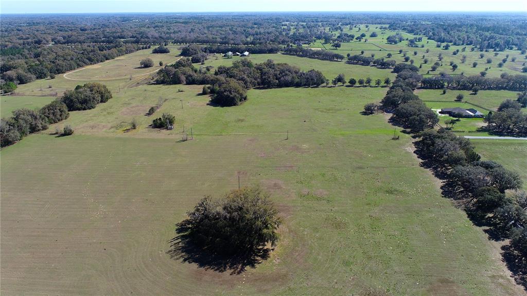 823 Southeast 116th Pl Road Ocala, FL 34480 - Photo 8 of 15 an aerial view of a house with a yard