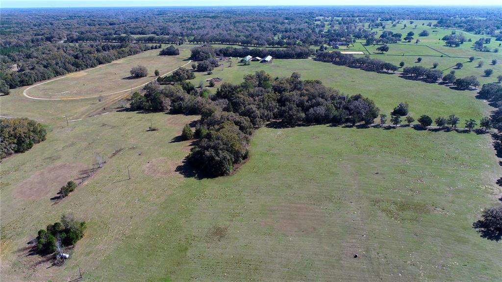 823 Southeast 116th Pl Road Ocala, FL 34480 - Photo 10 of 15 an aerial view of a house with a garden