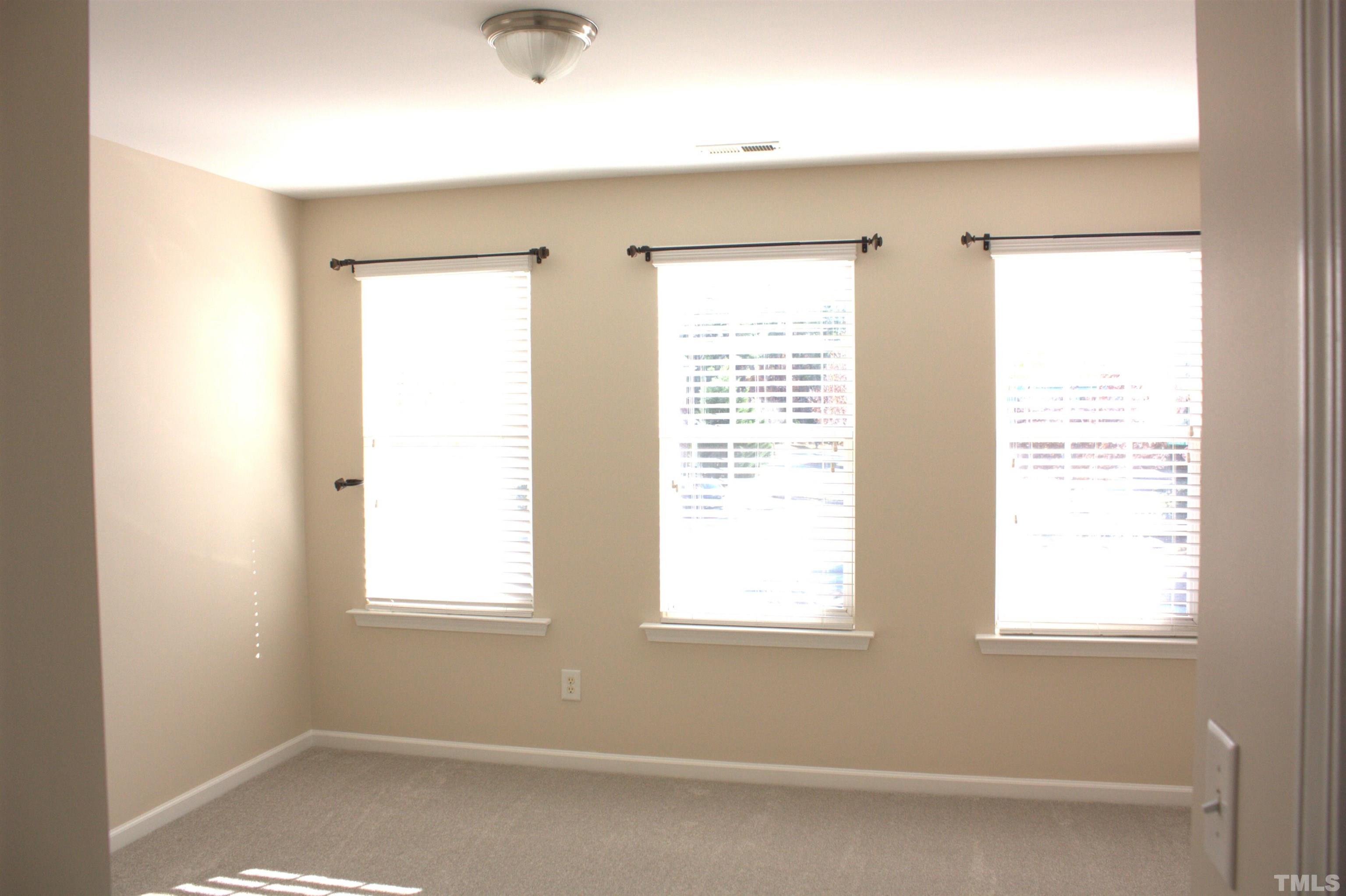 7802 Spungold Street Raleigh, NC 27617 - Photo 13 of 23 a view of a livingroom with a window