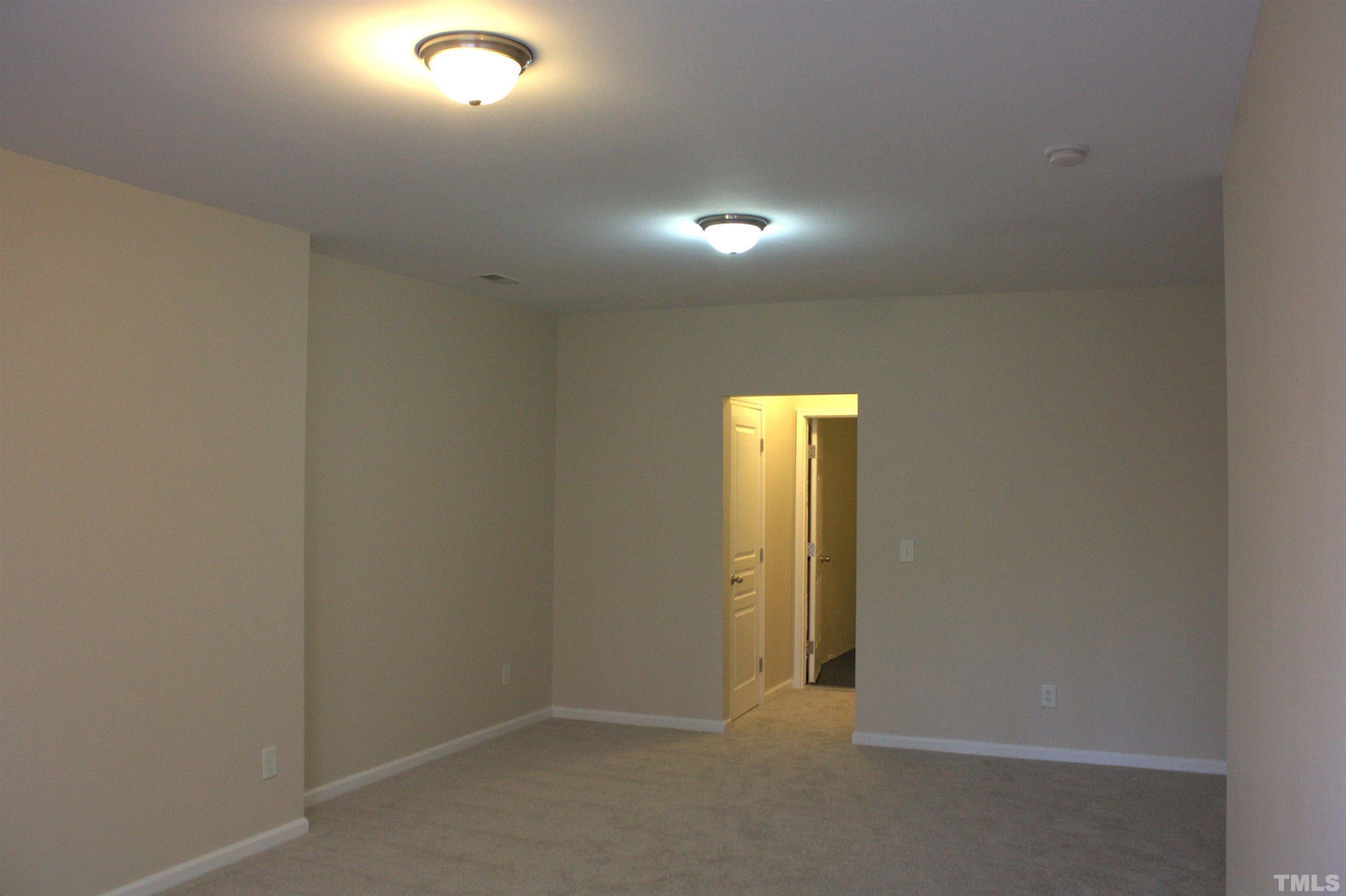 7802 Spungold Street Raleigh, NC 27617 - Photo 16 of 23 a view of an empty room