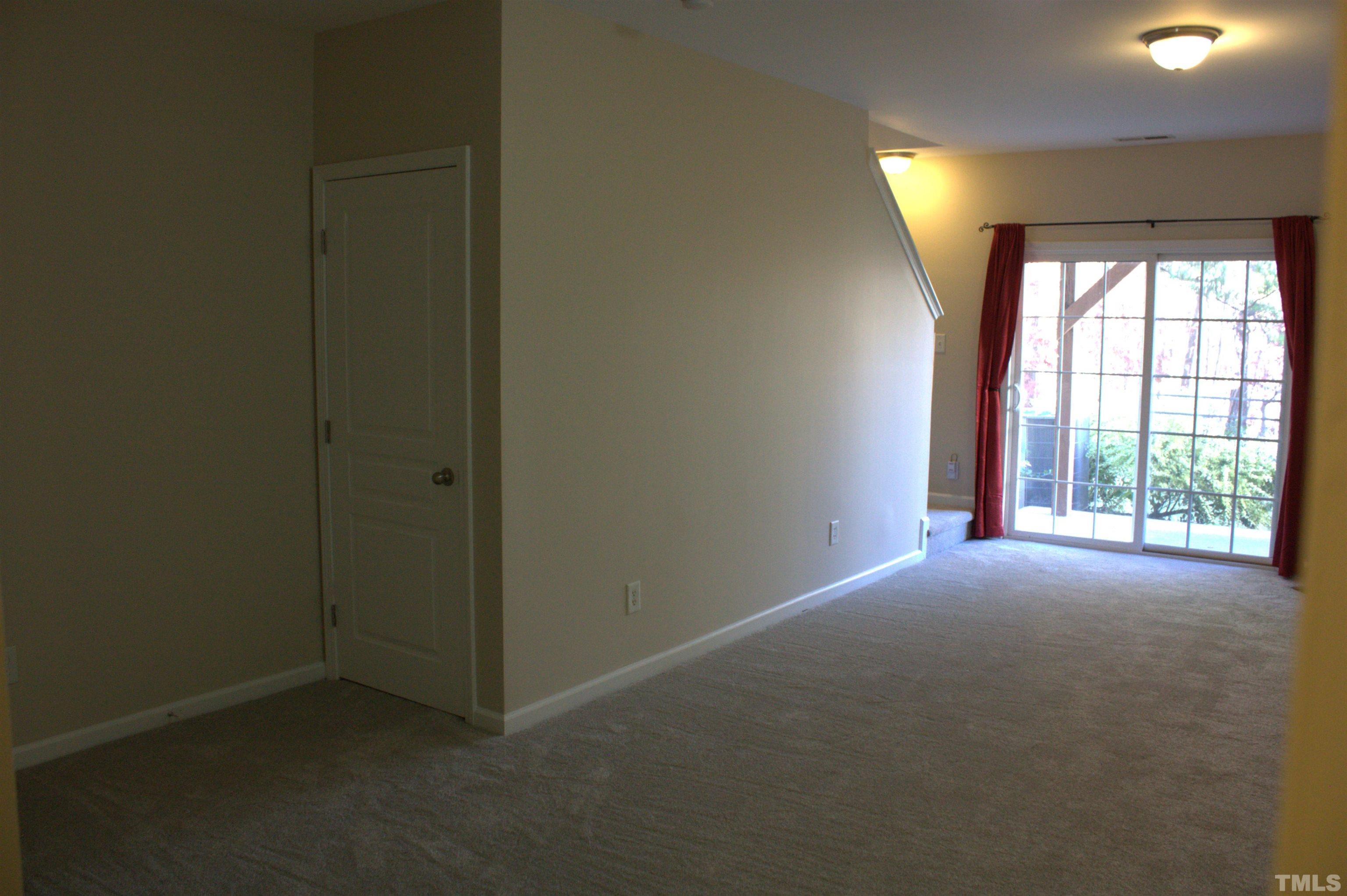 7802 Spungold Street Raleigh, NC 27617 - Photo 17 of 23 an empty room with windows and closet