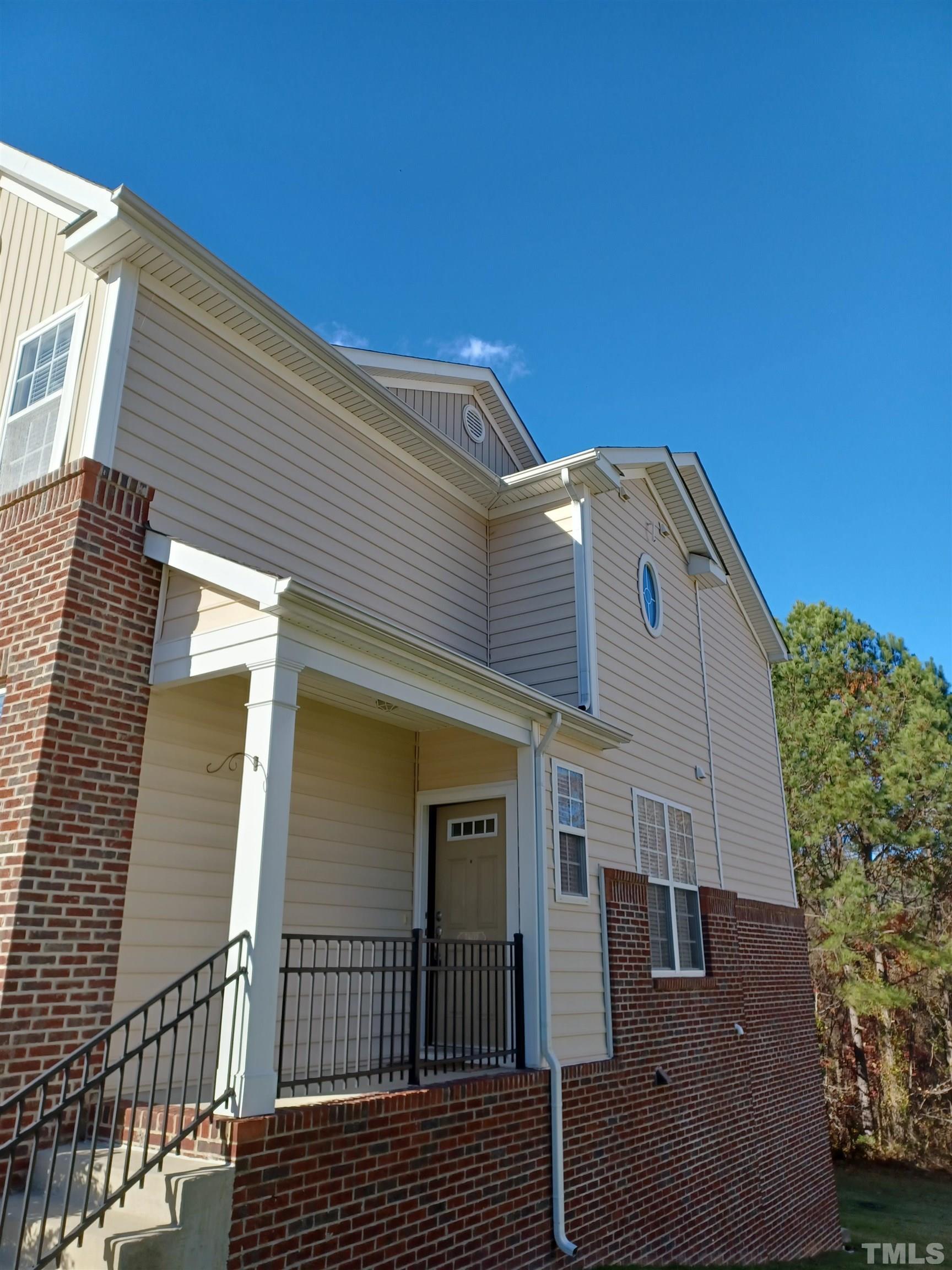 7802 Spungold Street Raleigh, NC 27617 - Photo 2 of 23 a view of a house with a balcony