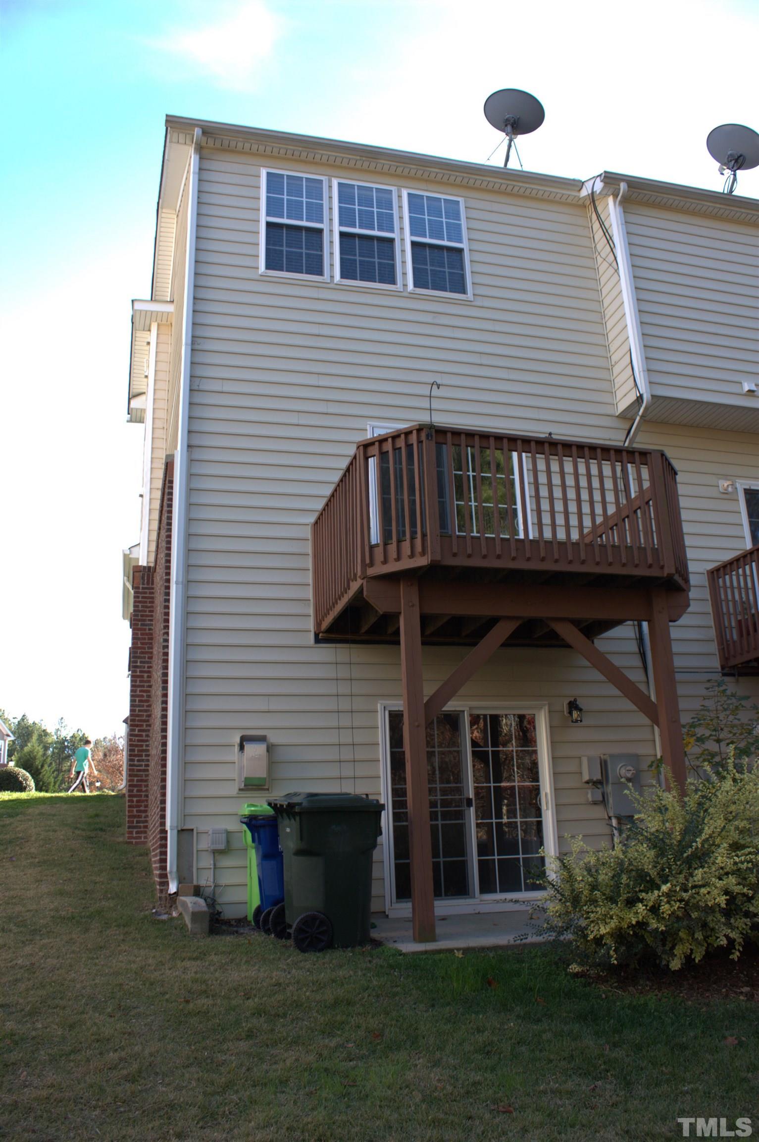7802 Spungold Street Raleigh, NC 27617 - Photo 21 of 23 a view of a house with a garden