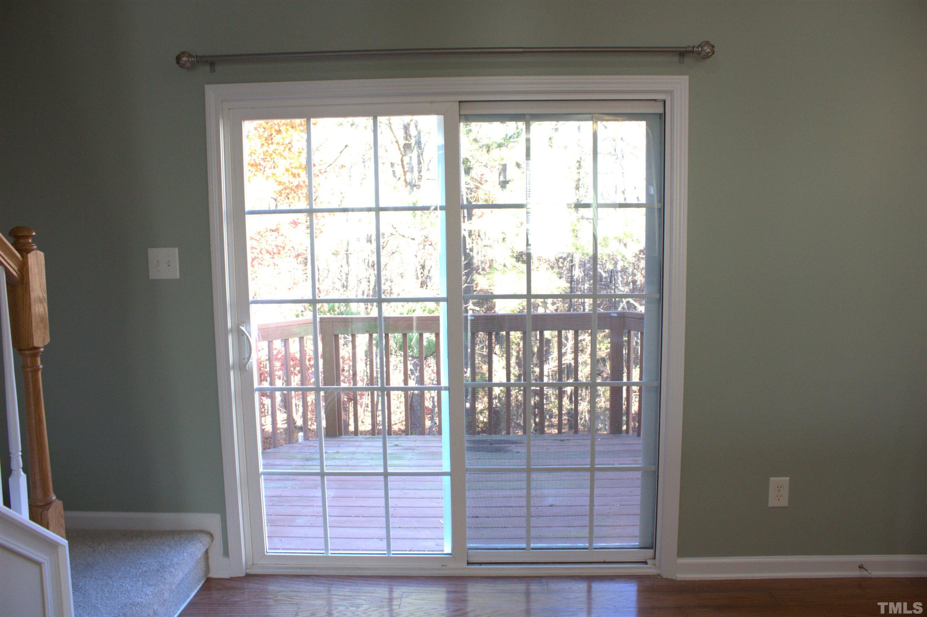 7802 Spungold Street Raleigh, NC 27617 - Photo 9 of 23 a view of wooden floor and windows