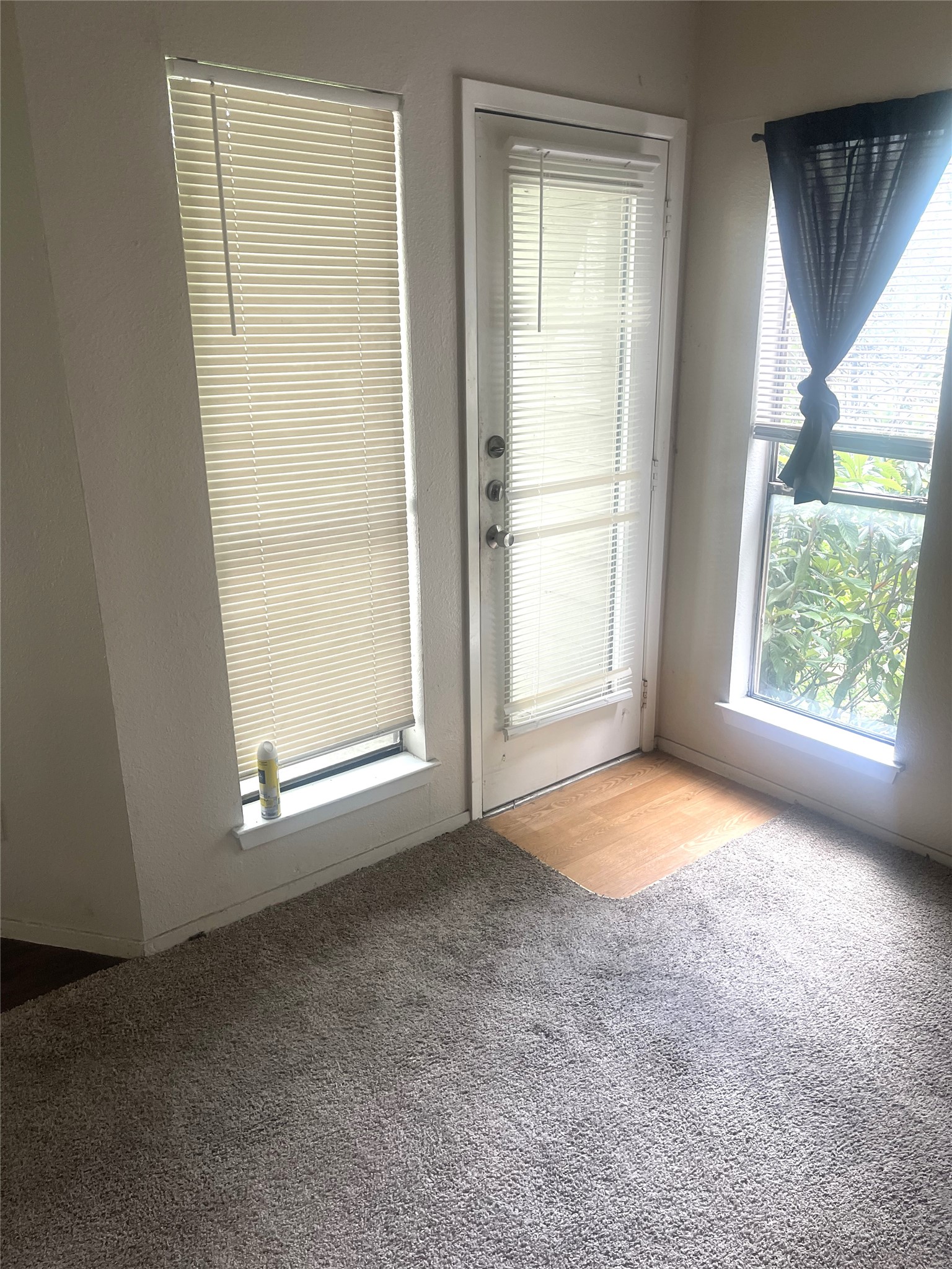 2005 West Loop, Unit D2 Austin, TX 78758 - Photo 9 of 31 an empty room with windows