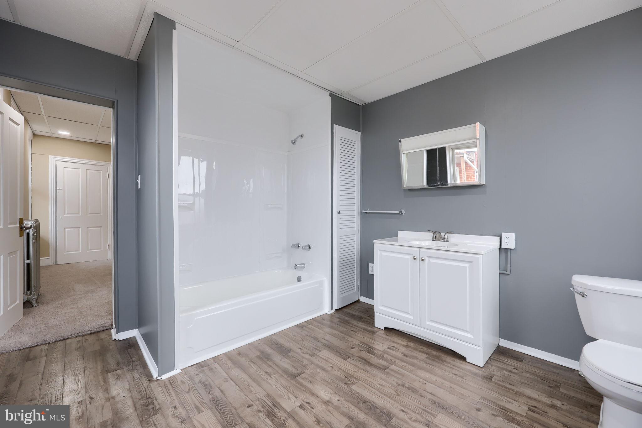 138 South 6th Street Columbia, PA 17512 - Photo 21 of 28 a bathroom with a sink a toilet and shower