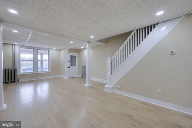 a view of an entryway with wooden floor