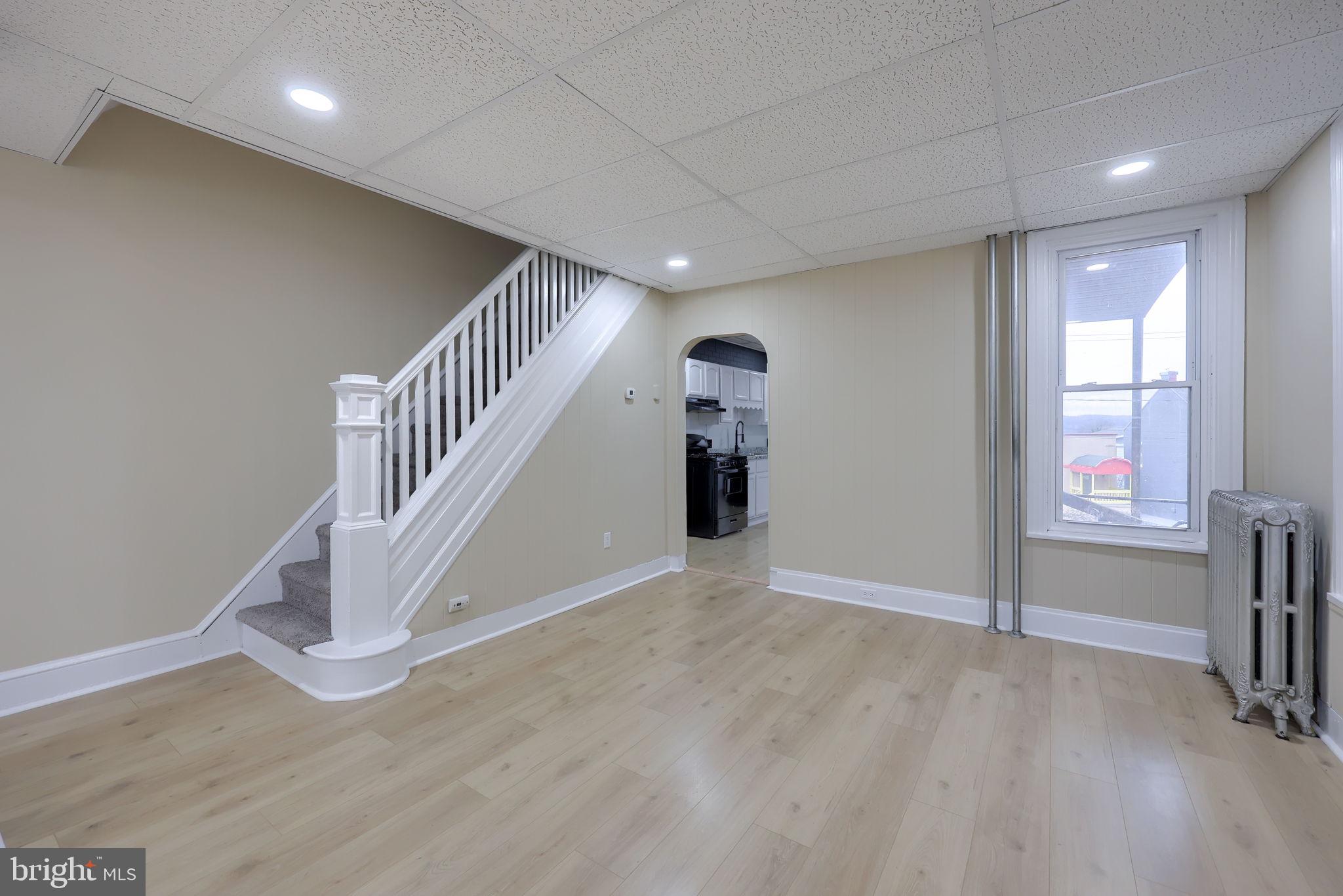 138 South 6th Street Columbia, PA 17512 - Photo 8 of 28 wooden floor in an empty room with a window