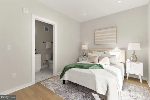 a bedroom with a bed and a couch