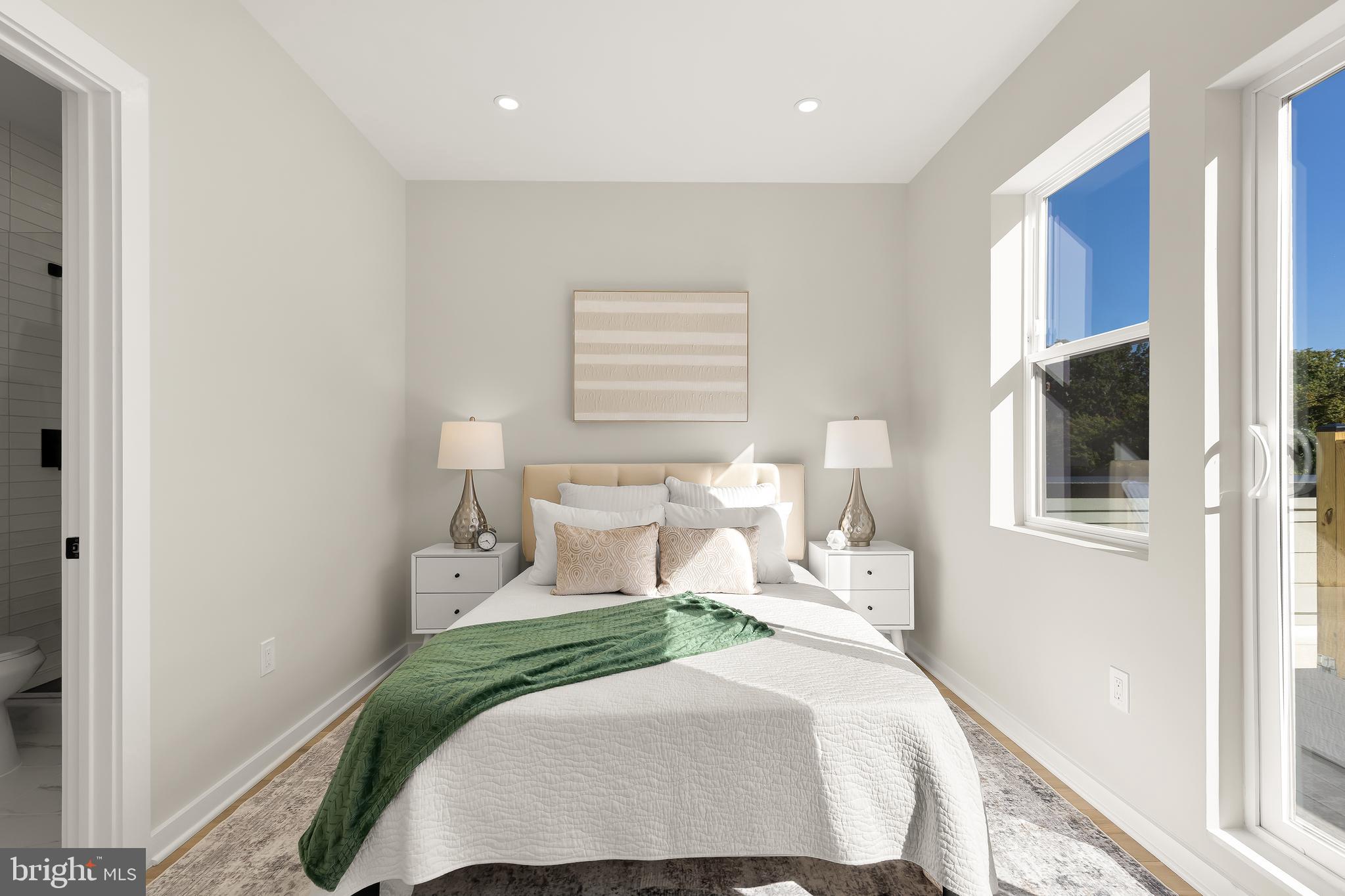 2606 41st Street Northwest, Unit PH Washington, DC 20007 - Photo 16 of 29 a bedroom with a bed and a window