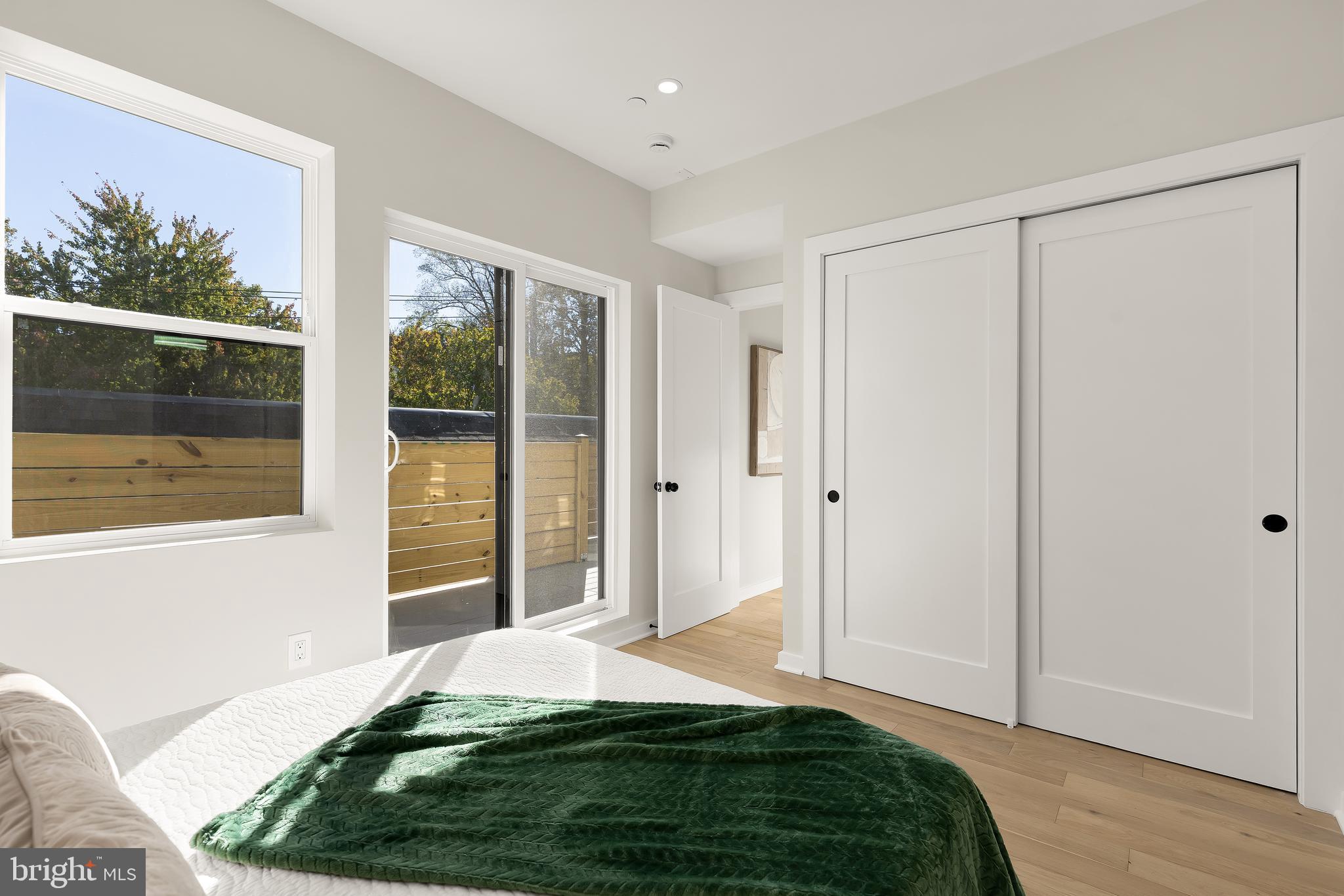 2606 41st Street Northwest, Unit PH Washington, DC 20007 - Photo 17 of 29 a room that has a bed and a window