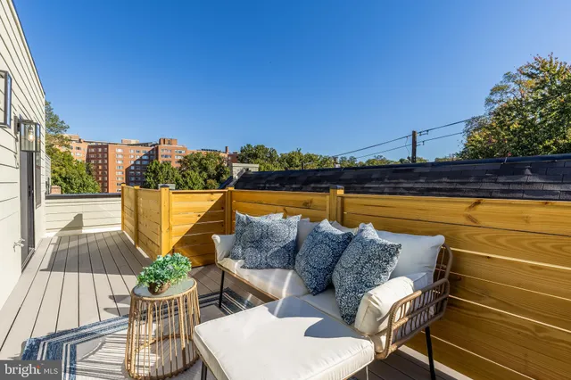 a view of a patio with couches and pool