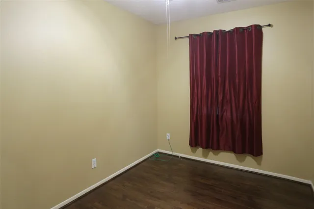 a bathroom with a toilet and shower