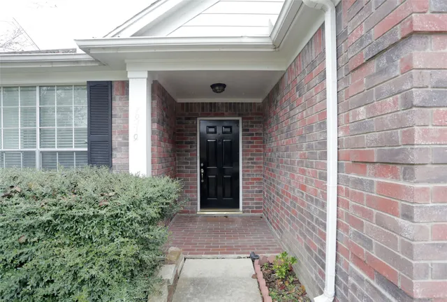 an entrance to house with yard
