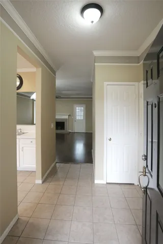 a kitchen with white cabinets and appliances