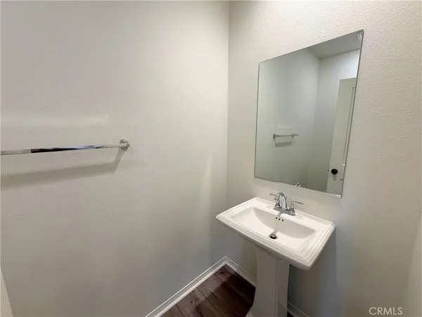 an empty room with a window and a ceiling fan