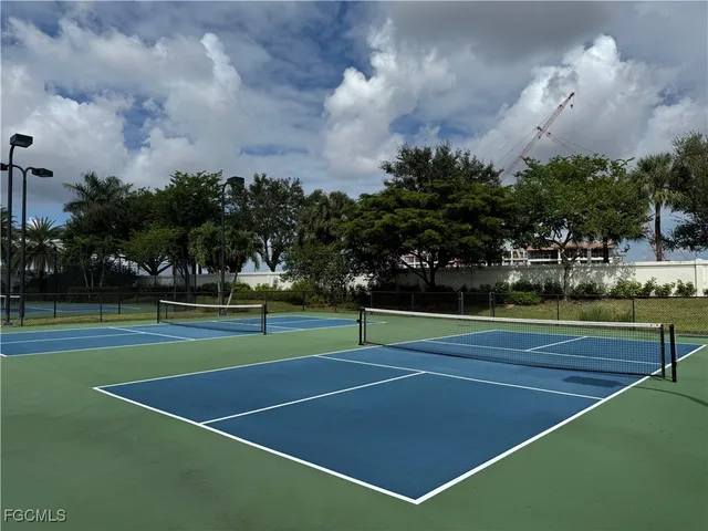 a view of an outdoor space and tennis court