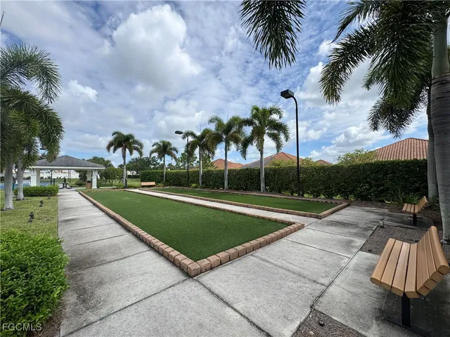 a view of a park with a slide and table
