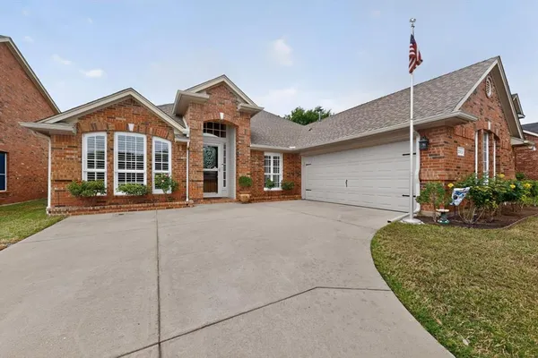 a view of a house next to a yard