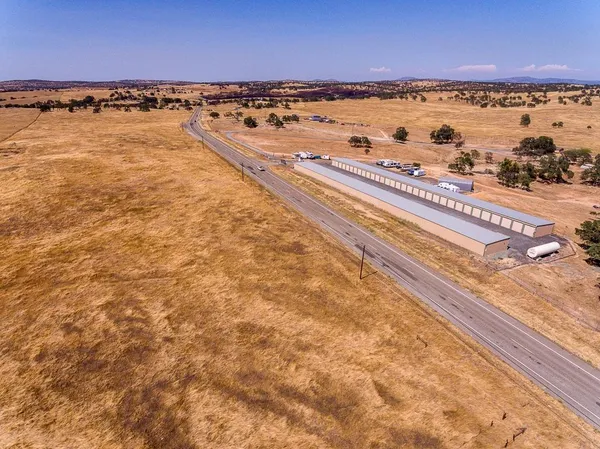 a view of a yard with wooden floor
