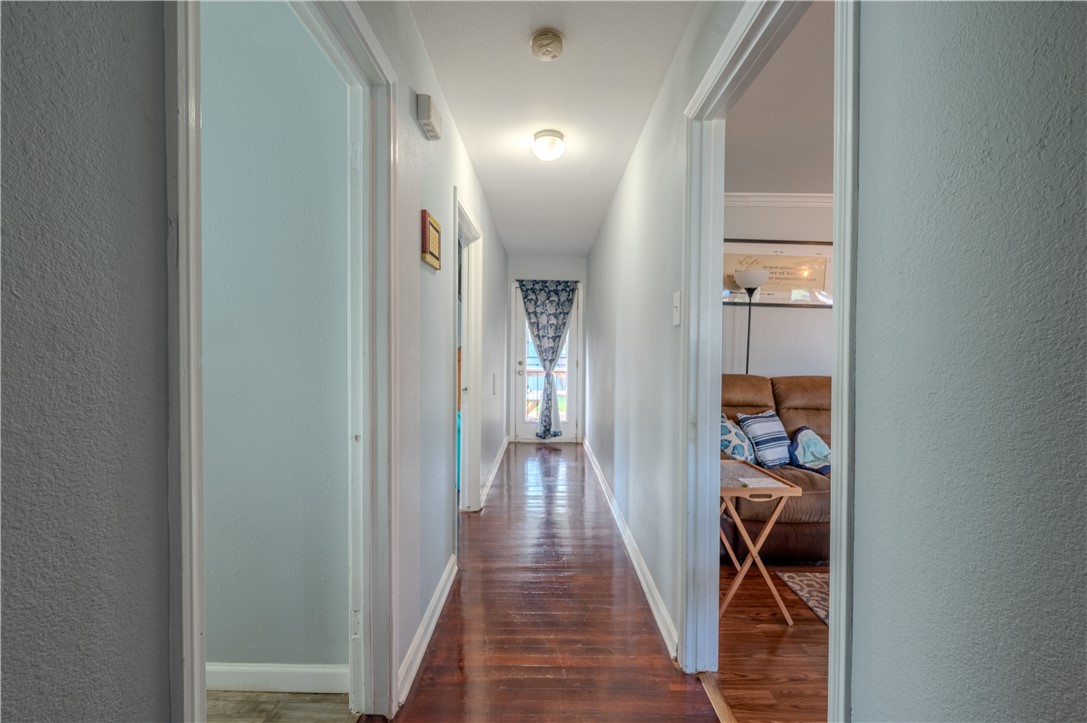 1201 Devon Drive Corpus Christi, TX 78404 - Photo 13 of 23 a view of a hallway with wooden floor and a bathroom